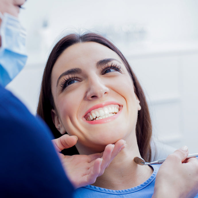 Patient at dentist having surgical dental treatment